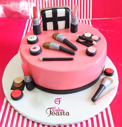 Makeup Kit On Pink Cake